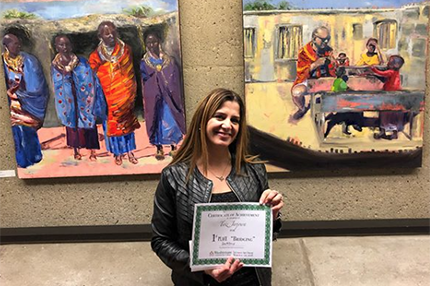 Therese Basha Jarjoura with her WCC Student Art Show entries, including Best of Show winner